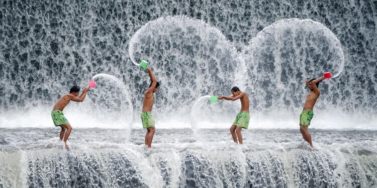 Young people splashing water on each row of masks used in Core Energetics